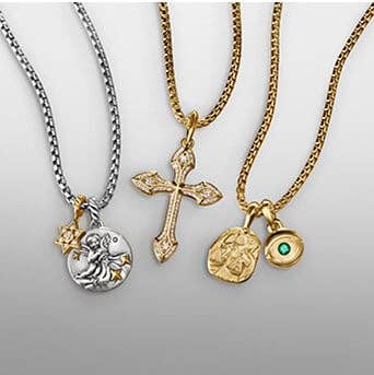 A variety of David Yurman charms and amulets for men and women on gold and silver chains.